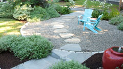 Pebble patio with stepping stones and outdoor seating