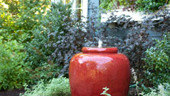 Garden pot sculpture and water feature with plantings